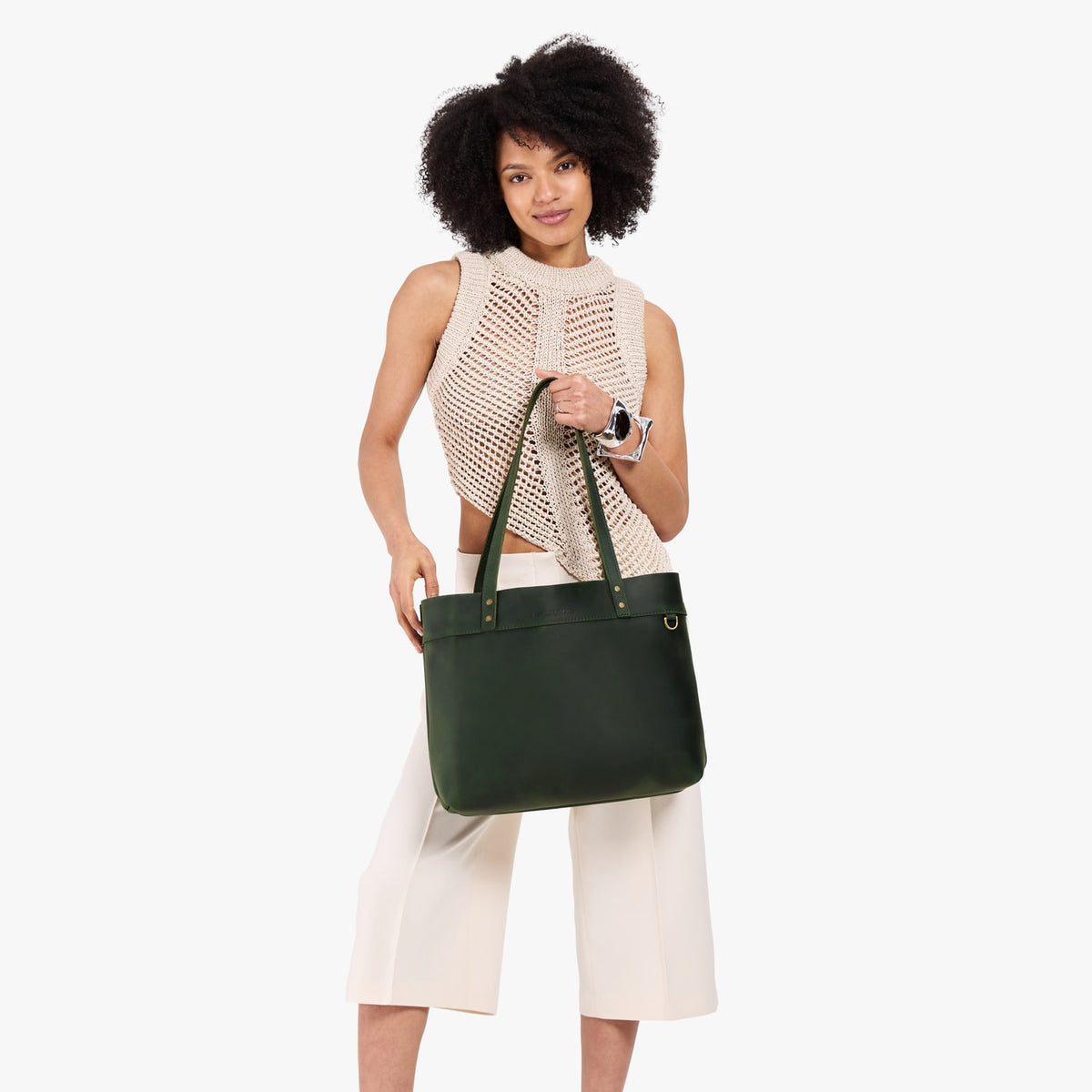 Evergreen*Large*Classic | Model wearing leather tote bag with riveted straps and exterior key loop