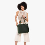 Evergreen Large Classic | Model wearing leather tote bag with riveted straps and exterior key loop