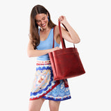 Phoenix Large Classic | Model wearing leather tote bag with riveted straps and exterior key loop
