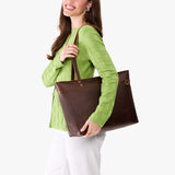 Coldbrew Large Zipper | Model wearing leather tote bag with riveted straps and exterior key loop