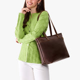 Coldbrew Large Zipper | Model wearing leather tote bag with riveted straps and exterior key loop