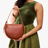 Chestnut | Model wearing a rounded structured shoulder bag