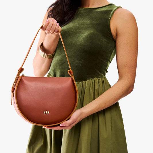 Chestnut | Model wearing a rounded structured shoulder bag
