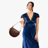 Cognac | Model wearing a rounded structured shoulder bag