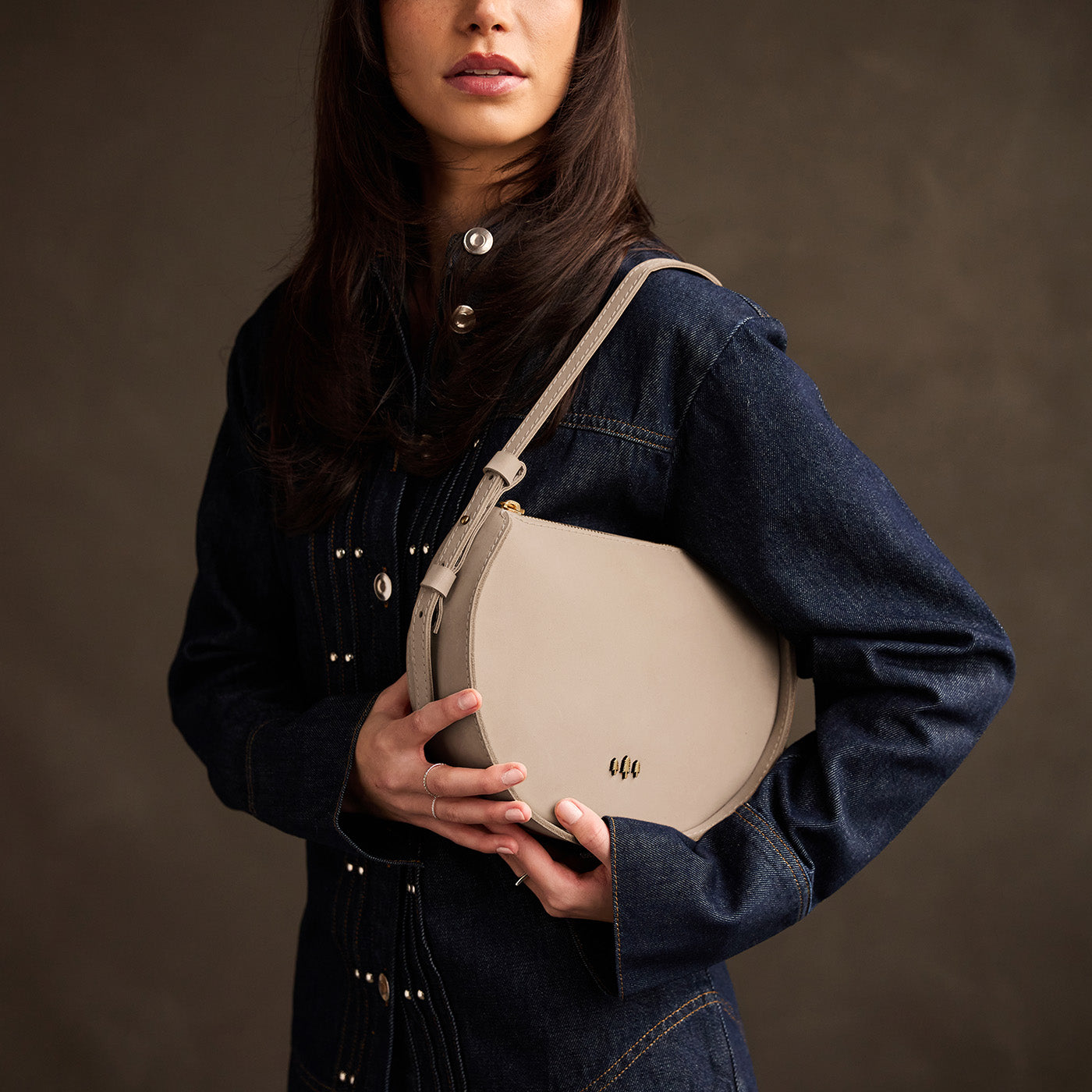Dragon Bone | Model wearing a rounded structured shoulder bag