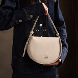 Dragon Bone | Model wearing a rounded structured shoulder bag