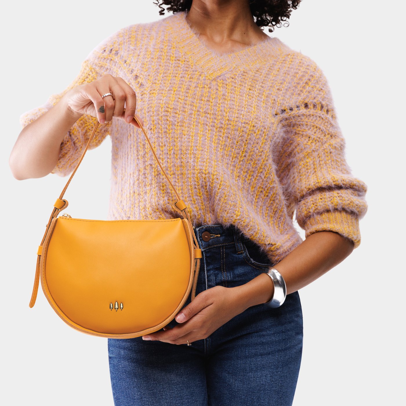 Sunflower | Model wearing a rounded structured shoulder bag
