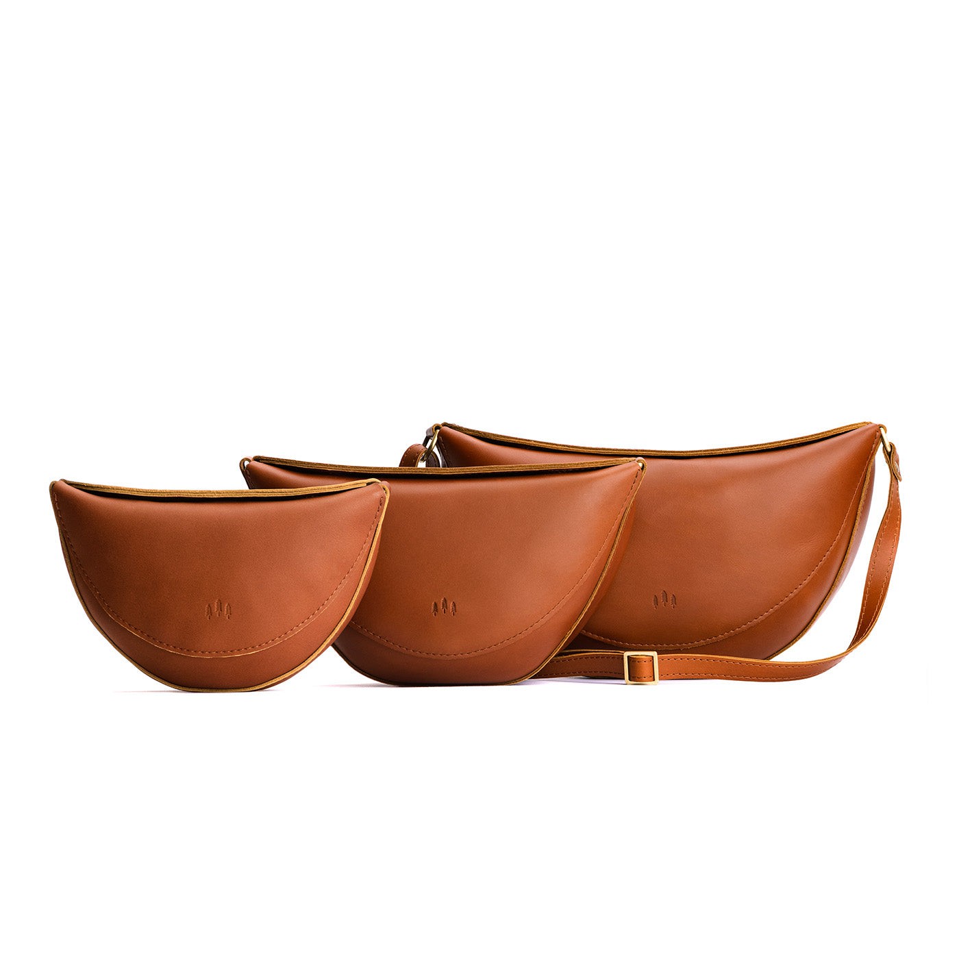 All Variants | Size comparison image of small, medium, and large Koala Sling Bags in Honey