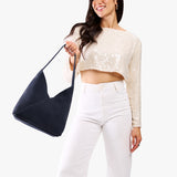 Alaska Blue Large | Model wearing mid-size shoulder bag with magnetic snap closure