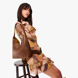 Mid-size shoulder bag with magnetic snap closure