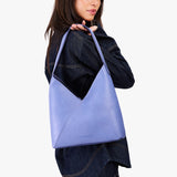 Aster Large | Model wearing mid-sized shoulder bag with magnetic snap 