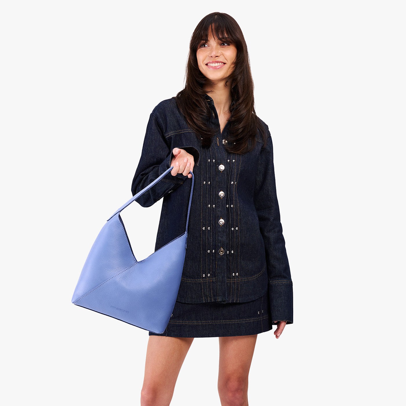 Aster*Large| Model wearing mid-sized shoulder bag with magnetic snap 