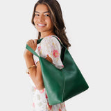 Bacalar Large | Model wearing mid-size shoulder bag with magnetic snap closure
