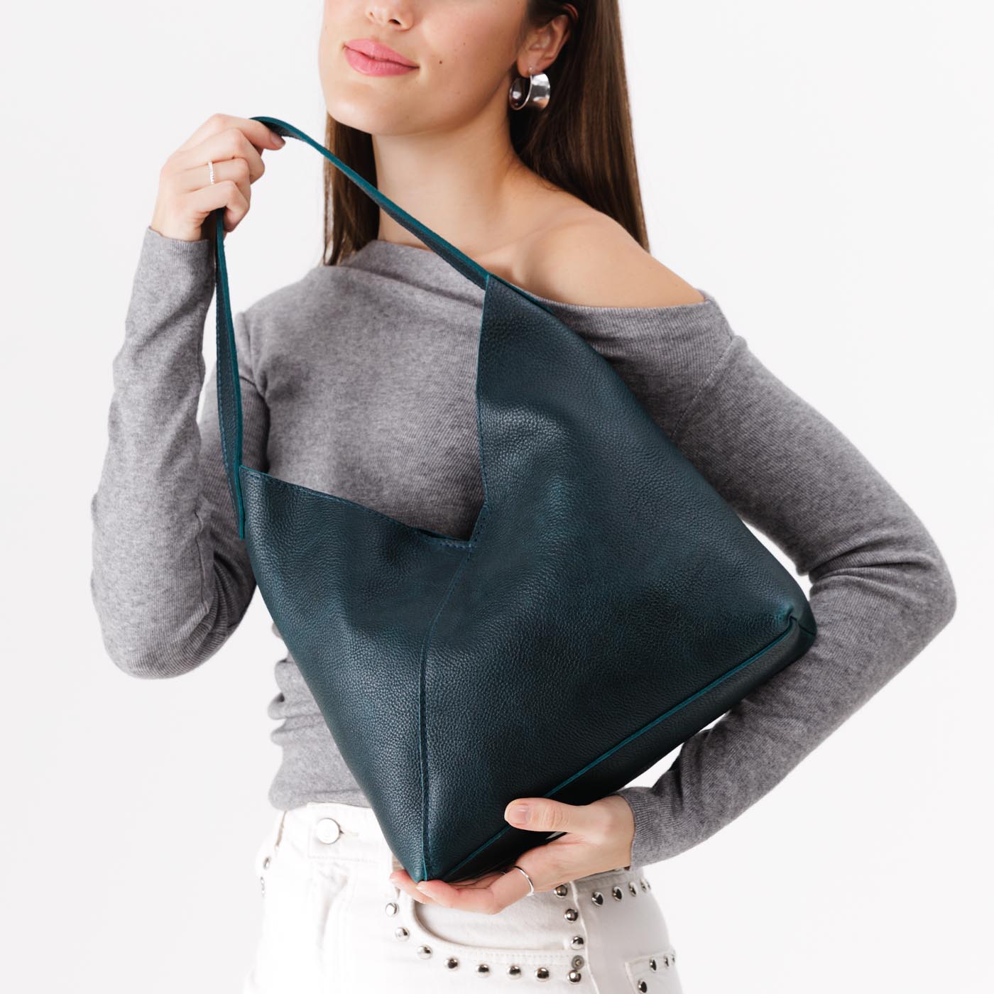 Boreal*Large | Model holding mid-size shoulder bag with magnetic snap closure