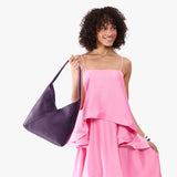 Empire Large | Model wearing mid-size shoulder bag with magnetic snap 