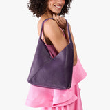 Empire Large | Model wearing mid-size shoulder bag with magnetic snap 