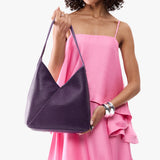 Empire Large | Model wearing mid-size shoulder bag with magnetic snap 