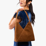Model carrying mid-size shoulder bag with magnetic snap closure