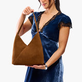 Jackson Large | Model wearing mid-size shoulder bag with magnetic snap closure