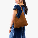 Jackson Large | Model wearing mid-size shoulder bag with magnetic snap closure