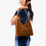 Model carrying mid-size shoulder bag with magnetic snap closure