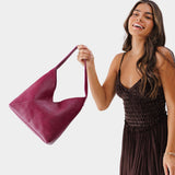 Lrg Naomi Shoulder Bag Mystery | Model holding handbag with cross bag stitching detail