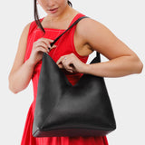 Pebbled--black Oversized | Model wearing large shoulder bag with magnetic snap closure