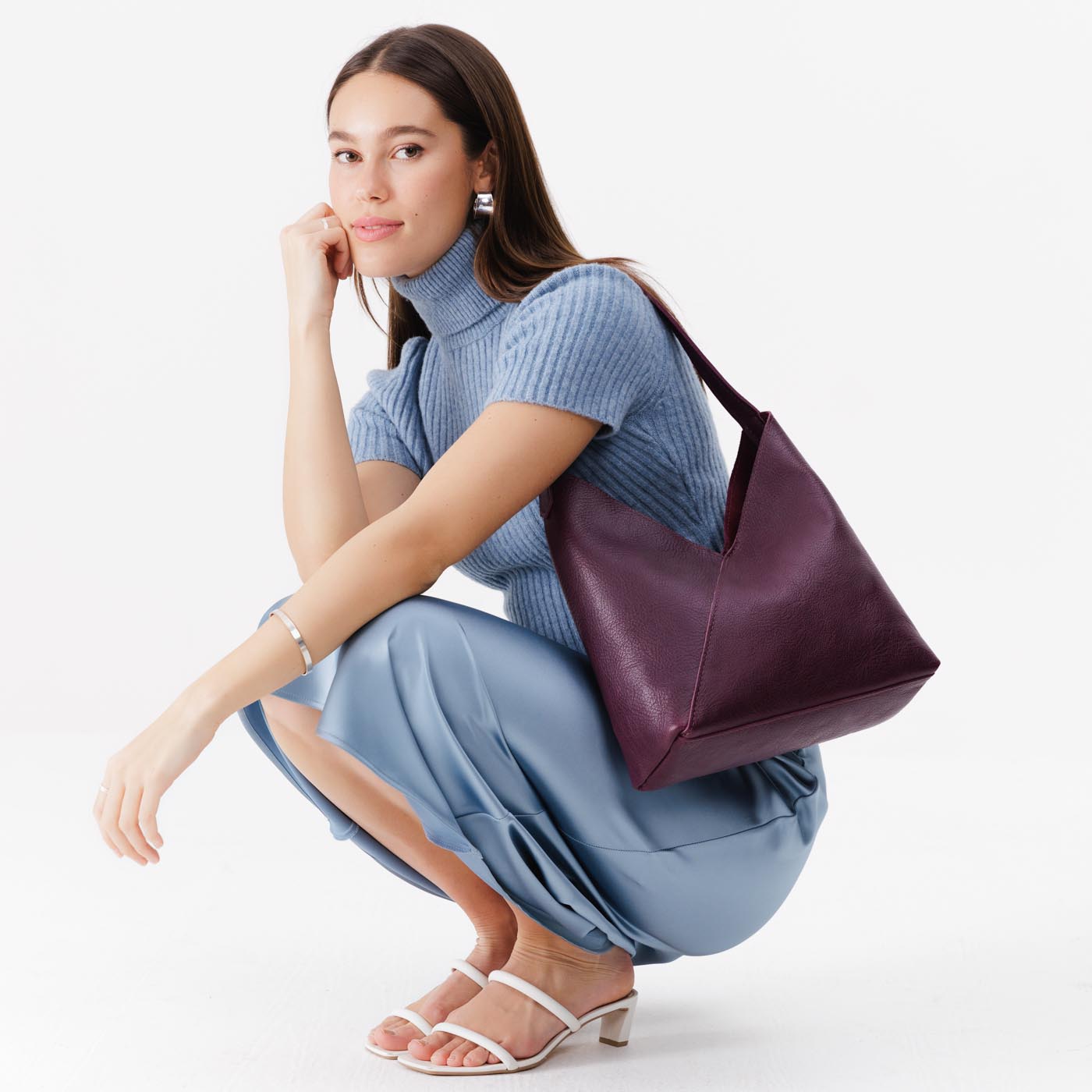 Plum*Large | Model wearing mid-size shoulder bag with magnetic snap 