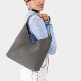 Smoke Grey Large | Model wearing mid-size shoulder bag with magnetic snap closure