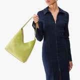 Wasabi Large | Model wearing mid-size shoulder bag with magnetic snap 