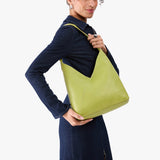 Wasabi Large | Model wearing mid-size shoulder bag with magnetic snap 