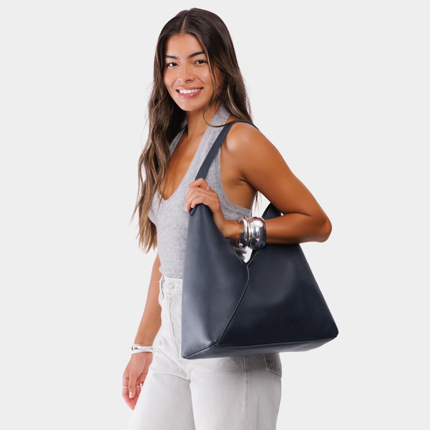 Night Owl*Oversized | Model wearing large shoulder bag with adjustable strap and magnetic snap closure