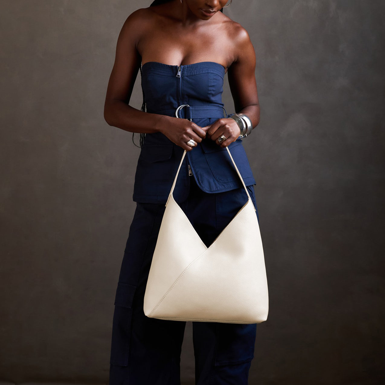 Pebbled Bone*Oversized | Model holding a large shoulder bag with magnetic snap closure