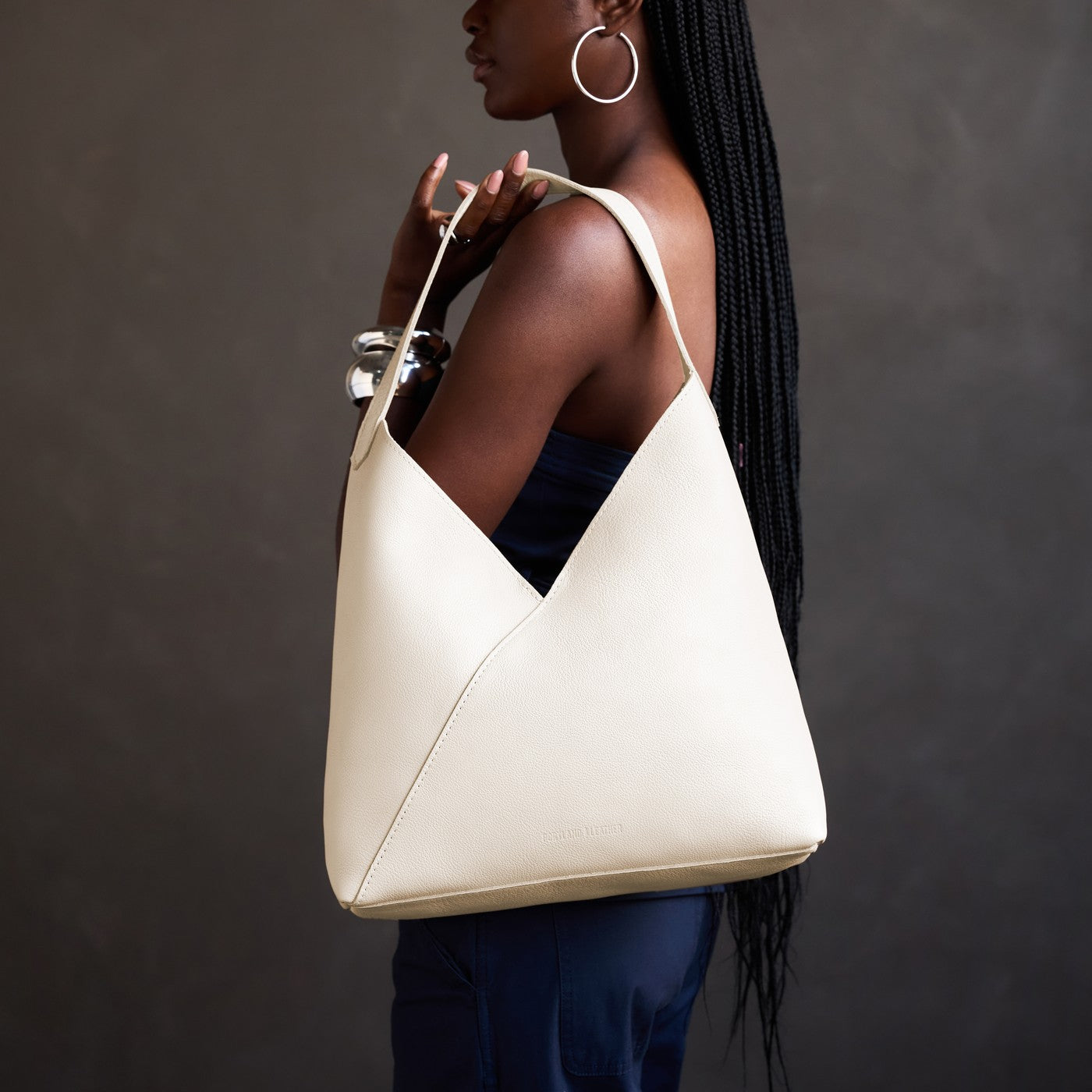 Pebbled Bone*Oversized | Model carrying a large shoulder bag with magnetic snap closure