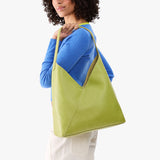 Wasabi Oversized | Model wearing large shoulder bag with magnetic snap closure