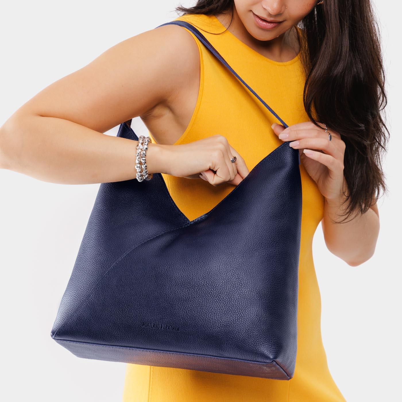 Cobalt*Oversized | Model wearing large shoulder bag with magnetic snap closure
