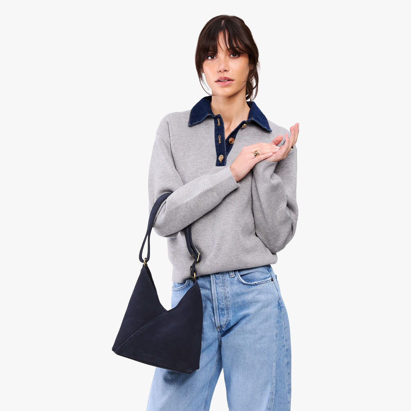 petite shoulder bag with adjustable strap and magnetic snap closure