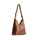 petite shoulder bag with adjustable strap and magnetic snap closure