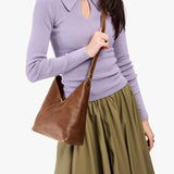 Asheville Small | Model wearing petite shoulder bag with adjustable strap and magnetic snap closure