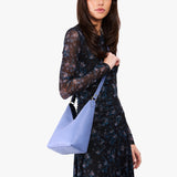 Aster Small | Model wearing petite shoulder bag with magnetic snap 