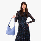 Aster Small | Model wearing petite shoulder bag with magnetic snap 