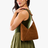 Jackson Small | Model wearing petite shoulder bag with adjustable strap and magnetic snap closure