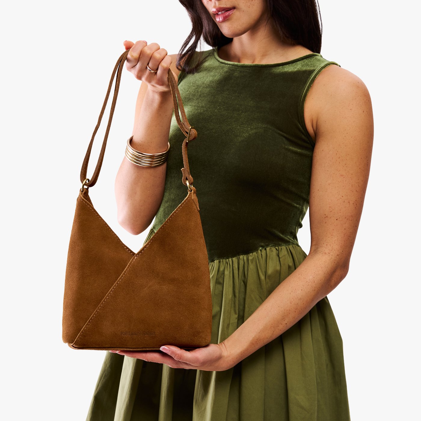 Petite shoulder bag with adjustable strap and magnetic snap closure