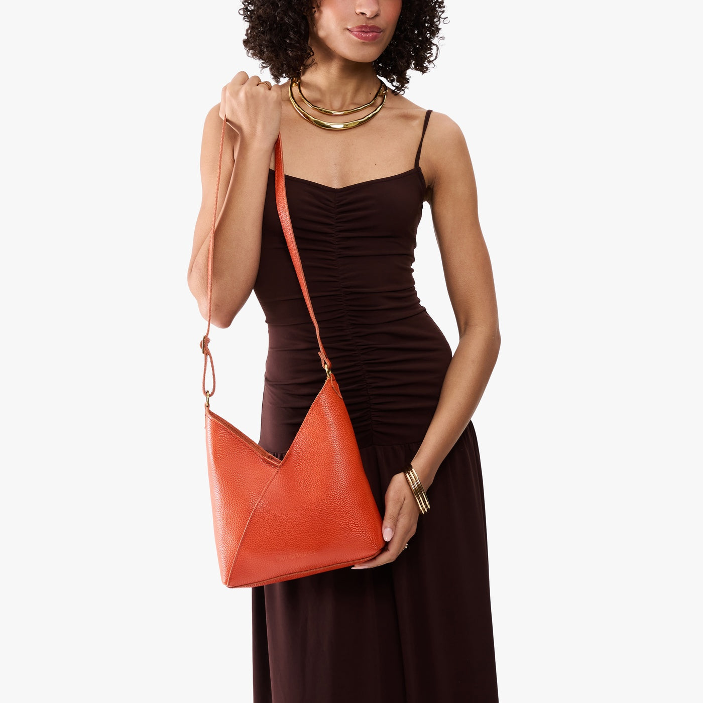 Koi*Small | Model wearing petite shoulder bag with adjustable strap and magnetic snap closure