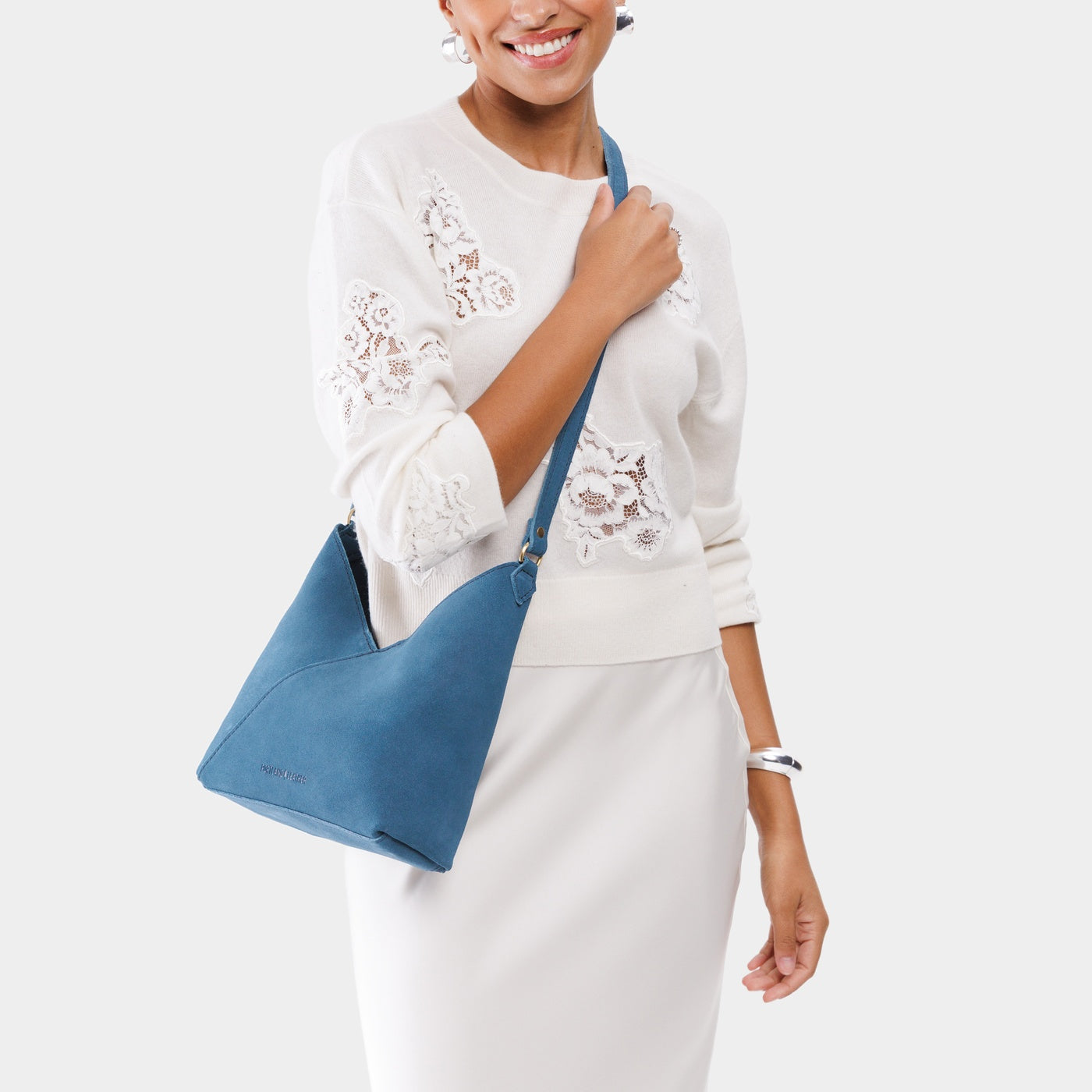 Mariner Blue*Small | Model wearing petite shoulder bag with adjustable strap and magnetic snap closure