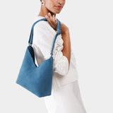 Mariner Blue Small | Model wearing petite shoulder bag with adjustable strap and magnetic snap closure