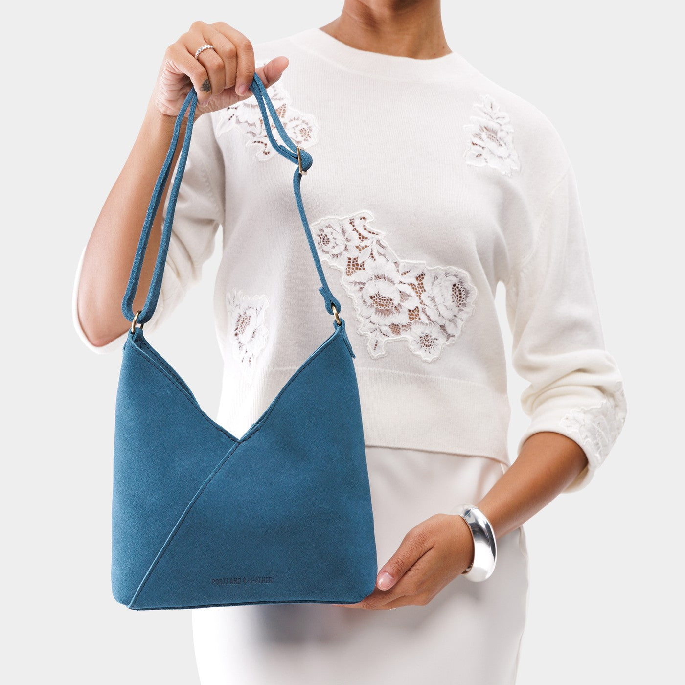 Petite shoulder bag with magnetic snap closure