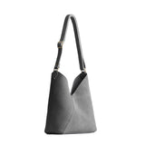 petite shoulder bag with adjustable strap and magnetic snap closure
