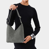 petite shoulder bag with adjustable strap and magnetic snap closure