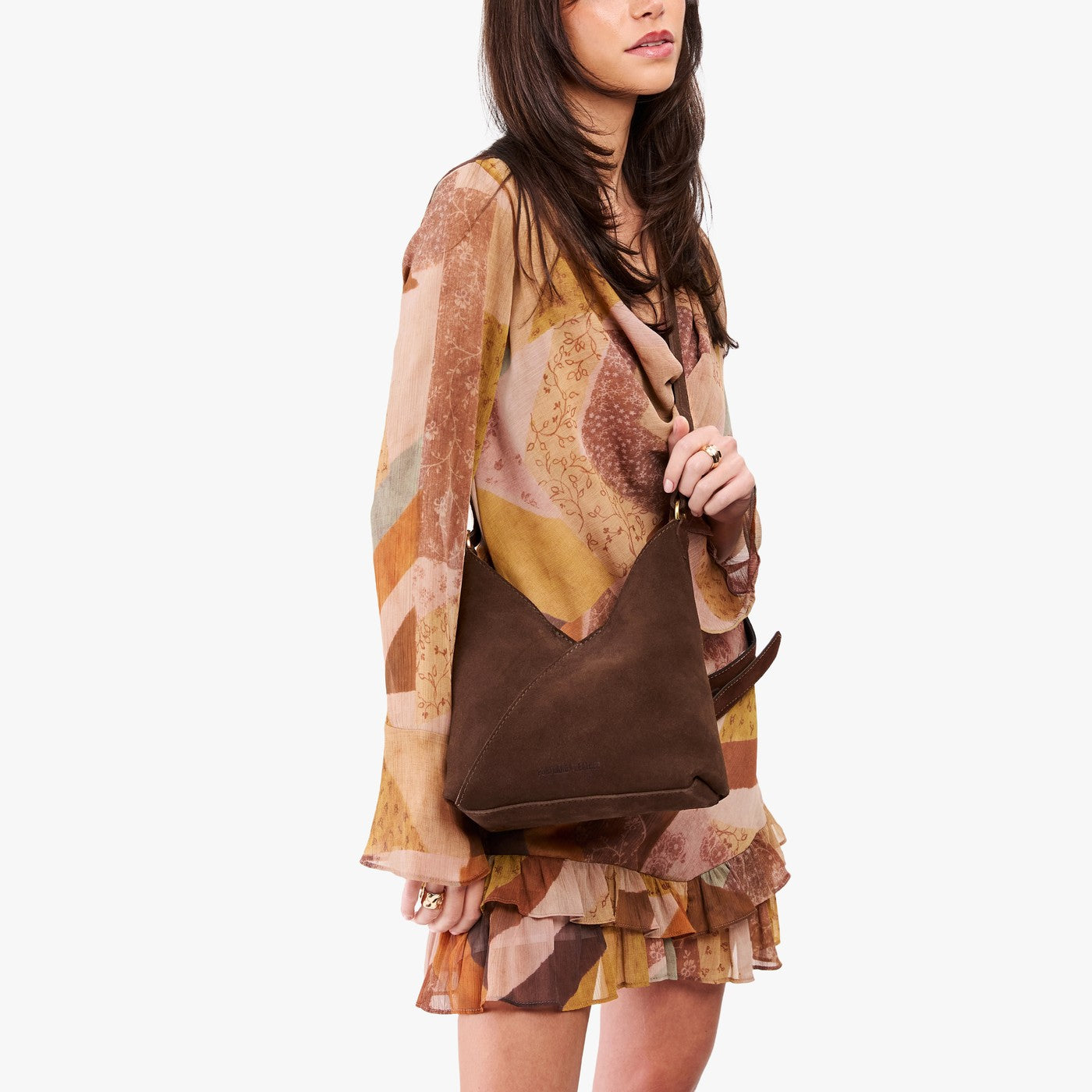 Stagecoach*Small | Model wearing petite shoulder bag with adjustable strap and magnetic snap closure